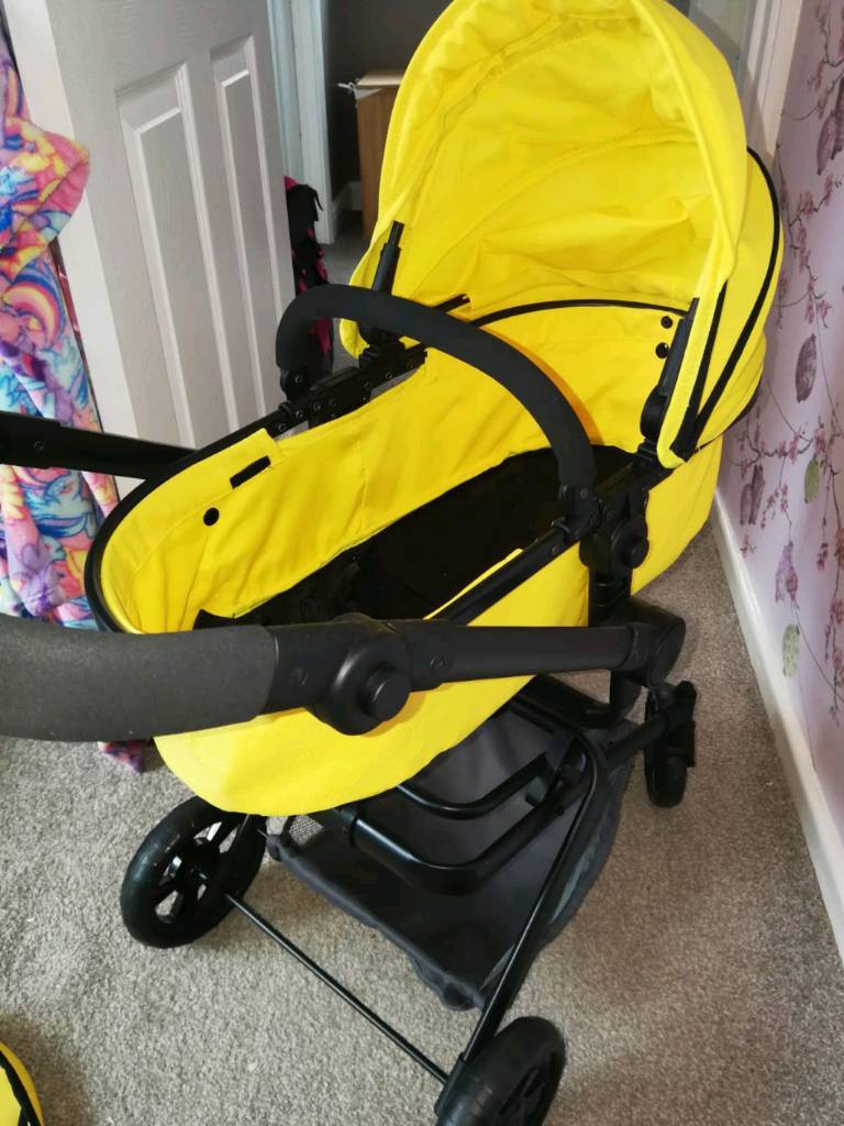 yellow dolls pram